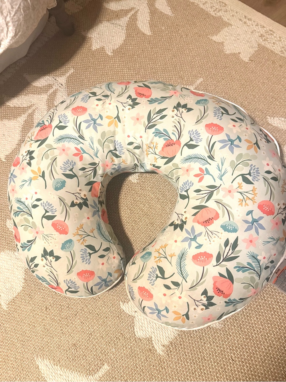 Boppy Floral Nursing Pillow in Cream with Coral, Teal, and Green Accents